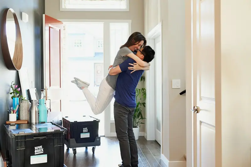 Couple celebrating in their new home
